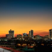 Beautiful evening view of the Fort Worth, TX city with the sun setting in the background.